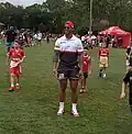 Isaako playing touch footy with kids