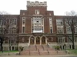 Four-storey red brock building constructed in Victoria Era architecture