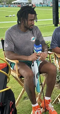 Jaylen Waddle being interviewed by CBS Sports at Miami Dolphins training camp in July 2025