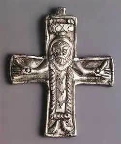 A small object depicting Jesus on the cross