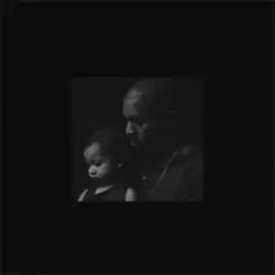 West holding his baby daughter North West.