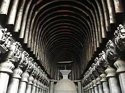 Timber ribs on the roof at the Karla Caves; the umbrella over the stupa is also wood
