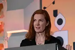 red head woman looking right