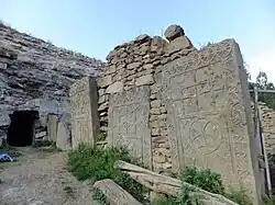 One of the series of khackhars on the south side of the monastery (currently reused as part of a partition wall) (2014 photo)