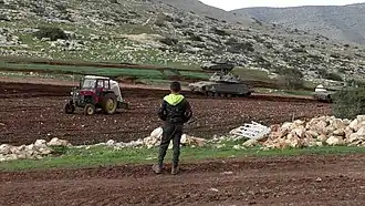 Israeli tank training in the fields of Khirbet Ibziq Palestinian village, December 2021