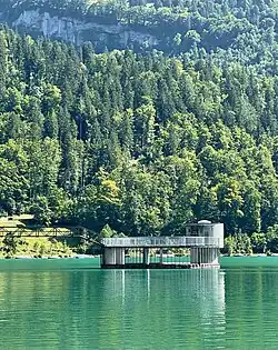 Spillway tower at the Rhodannenberg dam, releasing excess water during high inflow