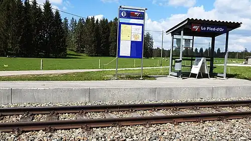 Canopy-covered shelter on a platform