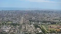 Aerial view of Lima, with Chacarilla (centre left) and the Pentagonito (right) in the foreground
