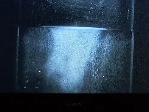 Liquid helium (in a vacuum bottle) at 4.2&nbsp;K (−268.95&nbsp;°C) and 1&nbsp;bar (15&nbsp;psi) boiling slowly.