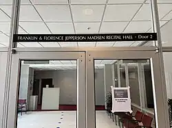 glass doors with the inscription "Franklin and Florence Jepperson Madsen Recital Hall, Door 2" above on a black plaque