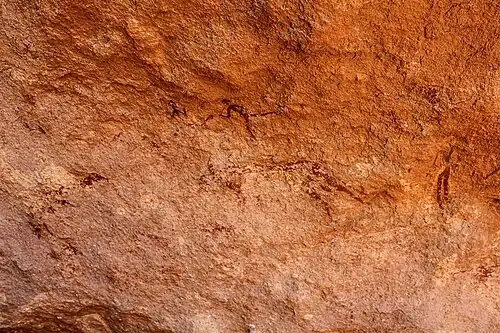 Rock painted shepherds with cattle