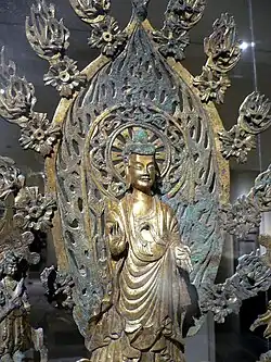 Altarpiece dedicated to Buddha Maitreya, Northern Wei dynasty (386–534), dated 524. Gilt bronze. Metropolitan Museum of Art.