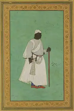 17th-century painting of a man in ceremonial dress with a staff, against a green background