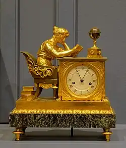 Mantel clock called The Reader; by Jean-Andre Reiche; circa 1810; matte and polished gilt bronze and "Vert de Mer" marble; 31 x 15 x 26&nbsp;cm; Montreal Museum of Fine Arts (Montreal, Canada)[19]