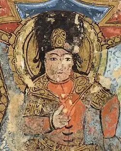 Right frontispiece: ruler in Turkic dress (long braids, large Sharbush fur hat, boots, fitting coat), in the Maqamat of al-Hariri, 1237 CE, probably Baghdad.[5]