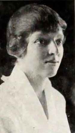 A young white woman photographed in 3/4 profile