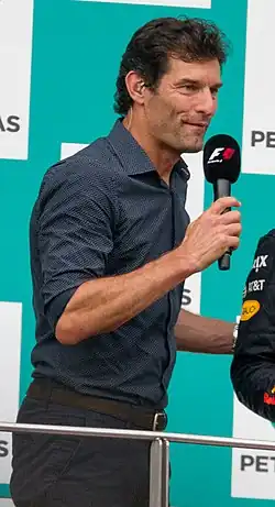 Portrait of Mark Webber smiling and looking to the left of the camera