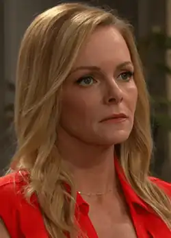 A blonde woman in a red dress.