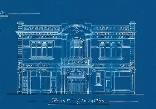 a dark blue background white line drawing of the front facade of a two story picture theatre with quite a few decorative details. Underneath the drawing in fancy printed handwriting 'Front Elevation'