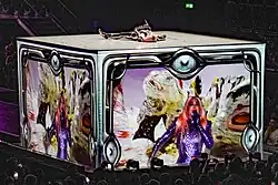 Madonna laying on top of a large box