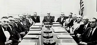 Mississippi's board of higher education, consisting of older white men in suits, sitting around a long boardroom table