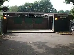 Rear entrance on the London-bound side, on the footpath to Sandy Lodge