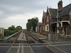 View along the railway tracks from the level crossing.