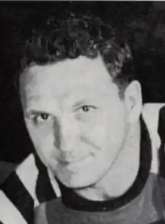 Black and white photo of Lallo in a hockey uniform and equipment