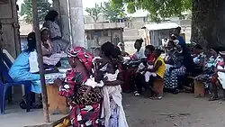 An image of mothers registering their children during immunization at primary health center in Masaka