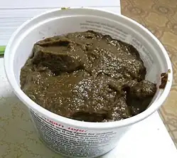 Mushroom ketchup in a plastic tub