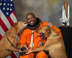 Image 19NASA astronaut Leland D. Melvin with his dogs Jake and Scout (from Dog behavior)