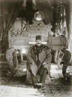 Naser al-Din Shah Qajar on the steps of the Sun Throne