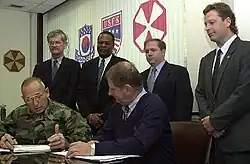 Image 16National Federation of Federal Employees officials sign a collective bargaining agreement with the U.S. 8th Army in October 2002.