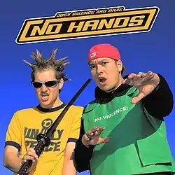 The artists stand against a clear sky. Joey Valence wears sunglasses and spiked hair and sneers at the viewer, leaning a katana against one shoulder. Brae wears a backwards baseball cap and is extending his hands toward the camera in concern.