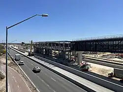 Highway median train station under construction