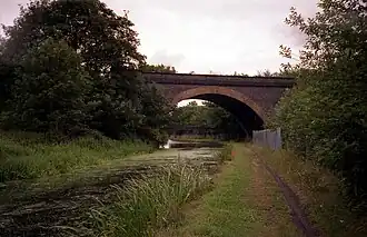 A brick bridge straddling a canal