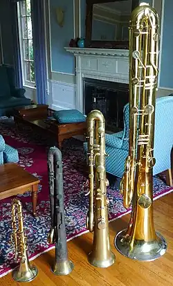 Ophicleides in four sizes, including soprano (left) and contrabass (right) replica instruments by Robb Stewart