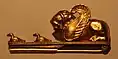 Castellani golds, made in imitation of the antique partly by incorporating original materials, 19th century, fibula with winged lion and ducks
