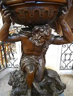 The base of the pulpit, supported by Samson kneeling on a lion
