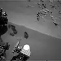 Curiosity's scoop "bite marks" in the sand patch at the Rocknest site (October 15, 2012).