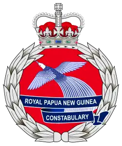 The emblem of the Royal Papua New Guinea Constabulary featuring featuring the Crown