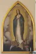 The large oil painting of the Blessed Virgin was painted over 100 years ago by Sacred Heart nun, Mother Mary Zahel. A school pupil, Rita de Lange was used to pose for the face. The painting has adorned both churches.