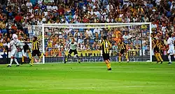 Player trying to head the ball into the goal