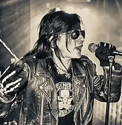 Lewis performing with L.A. Guns in 2010