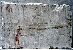 Photograph of personages in a relief