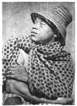 Promotional portrait of A.S. Mopeli-Paulus in Basotho blanket and hat, 1953