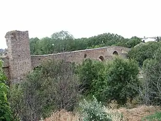 The ruins of the medieval bridge which gave the place its name