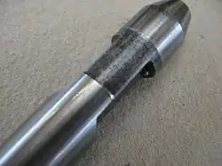 The slot in the tip of the broach where the broaching machine latches on to the broach to pull it through the workpiece