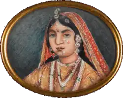 Portrait of the face of the Rani of Jhansi wearing a sari and lots of jewellery