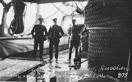 L to R, Rear Admiral Newton McCully, unknown Russian naval captain, Captain Zachariah Madison, commanding, aboard USS&nbsp;Des Moines, Russia, June 1919